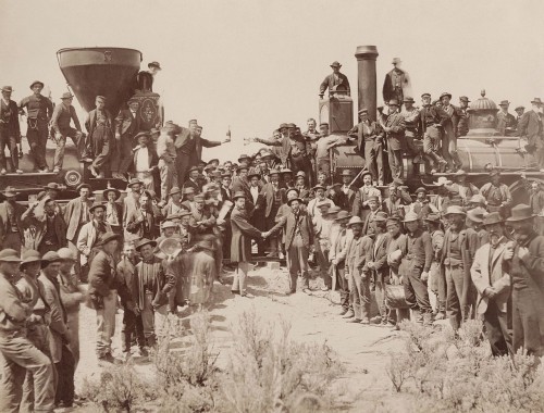The ceremony for the driving of the "Last Spike" the joining of the tracks of the CPRR and UPRR grades at Promontory Summit, Utah, on May 10, 1869, Andrew J. Russellâ€™s â€œEast and West Shaking Hands at Laying of Last Rail.â€ May 10, 1869. Image: Public Domain
