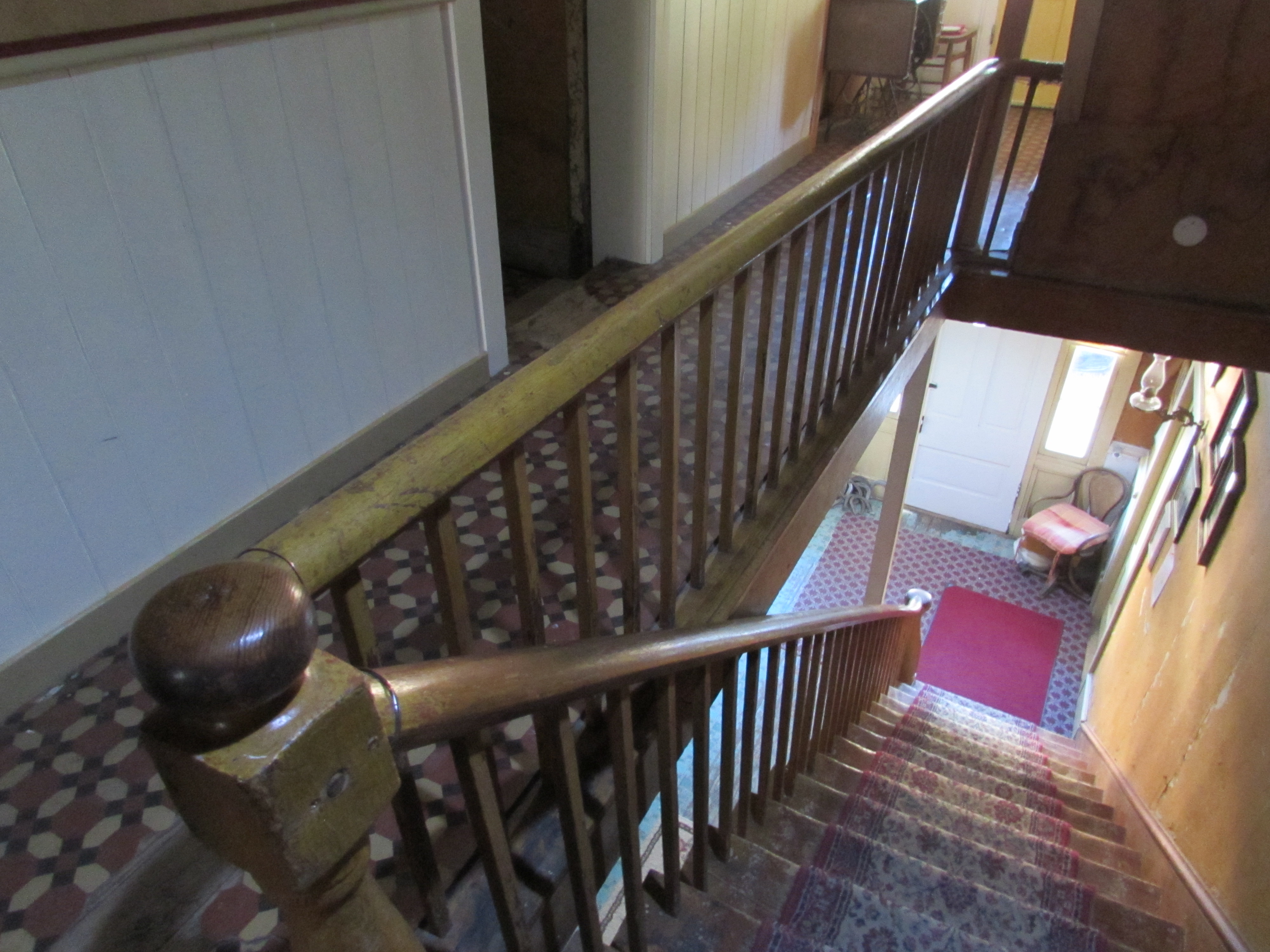 Historic Idaho Hotel staircase, as viewed from the second floor landing, outside guest rooms. Silver City, Idaho.
