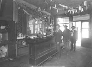 Kristin Holt | Historic Silver City, Idaho. Vintage photograph attributed to Silver City, Idaho. Shows men in a saloon, with a long mahogany bar.