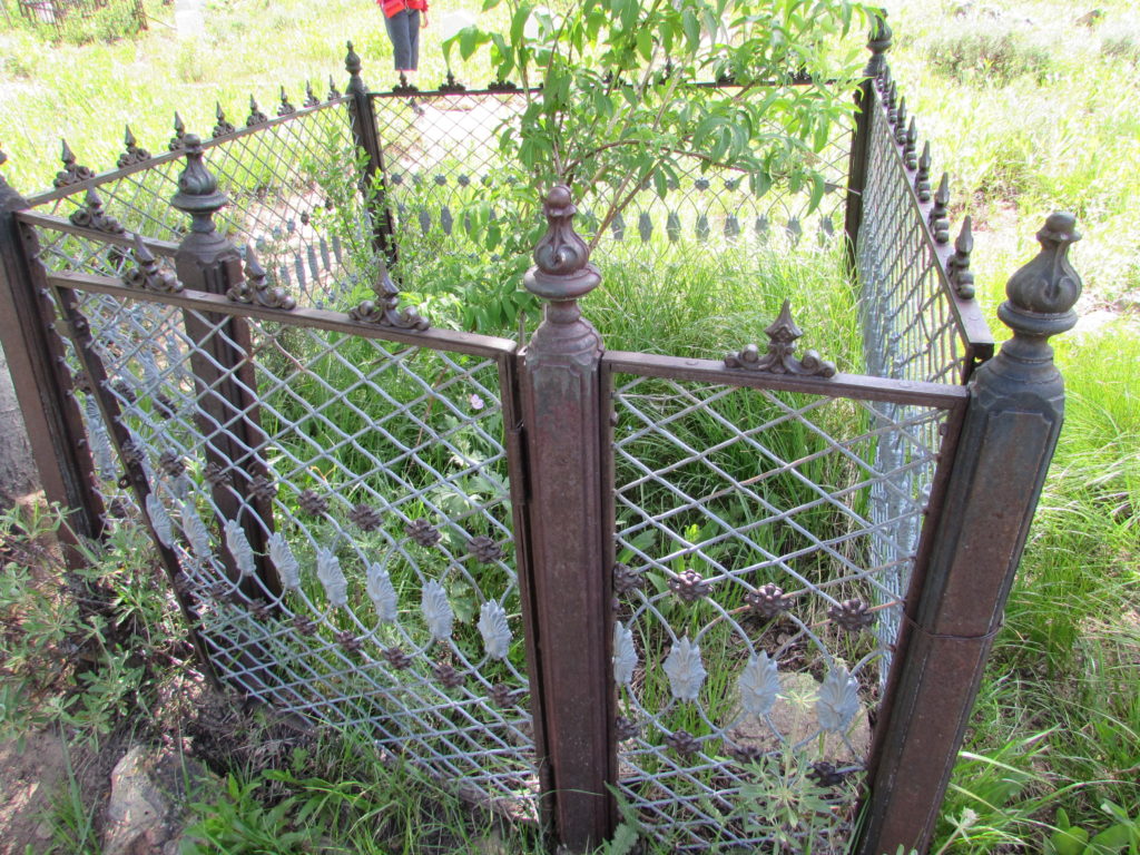 Kristin Holt | Silver City, Idaho's Ghost Town Cemetery. Closeup of a single Mourning Fence, encompassing one family's plots within the city cemetery. Image: Kristin Holt, June 2016.