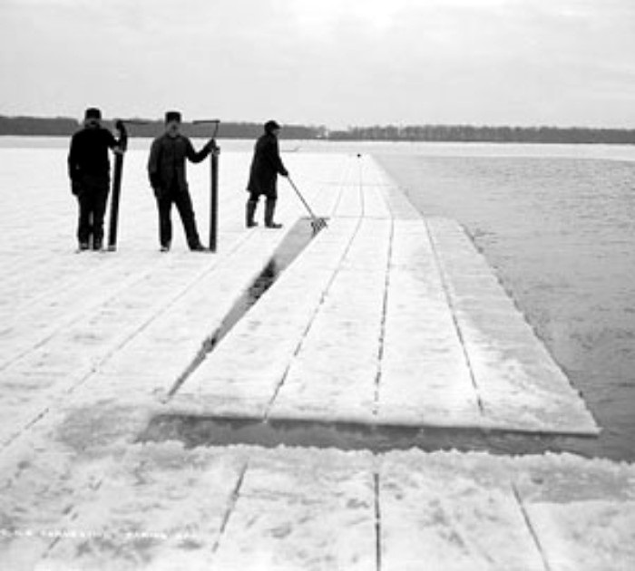 Kristin Holt | Nineteenth Century Ice Cutting, Part 3. Vintage phtoograph: three men, holding ice cutting tools, stand upon scored blocks of ice (frozen lake surface). Image: Library of Congress.