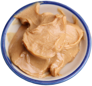 Kristin Holt | Peanut Butter in Victorian America. Image; Photograph of peanut butter in a blue-rimmed stoneware bowl. (Freepik.com; used with paid subscription)