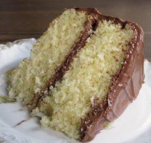 Kristin Holt | Photograph of homemade yellow cake with chocolate icing, known as "chocolate cake" in many mid-19th century recipe books.