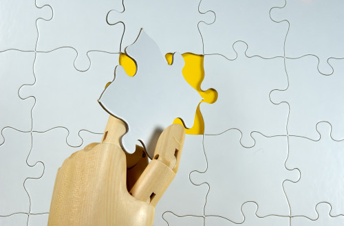 Kristin holt | Kristin Holt | Series vs. Serials. Photograph: wooden hand places the final puzzle piece. Copyright Dana Rothstein, Dreamstime Stock Photos.