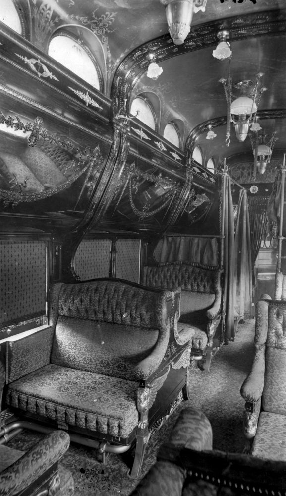 Kristin Holt | Luxury Travel 1890-Style. Image: Pullman Sleeper Car. Upholstered Seats folded down into a bed much like today's R.V. Trailers. The rounded overhead "bin" came down revealing another bed. Curtains provided privacy. Image: Public Domain