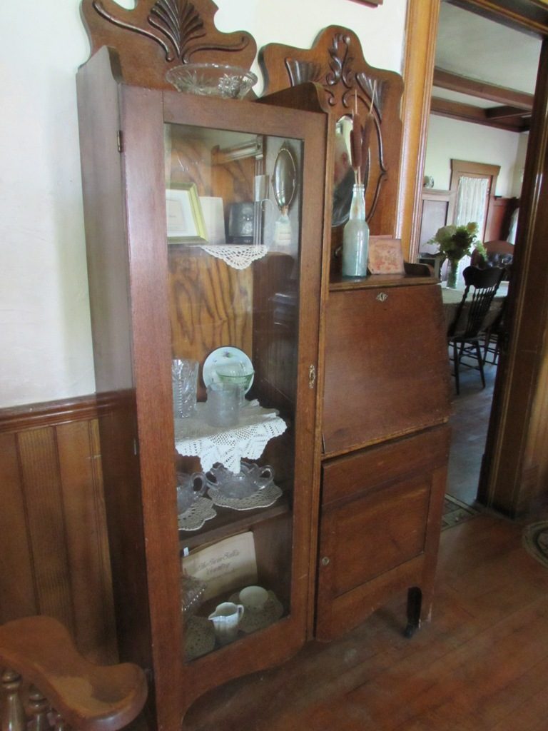 Kristin Holt | Victorian Combination Desk and Book Cabinet. Antique secretary desk and bookcase at Stricker Mansion, Stricker Ranch, Twin Falls County, Idaho. Photo by Kristin Holt.