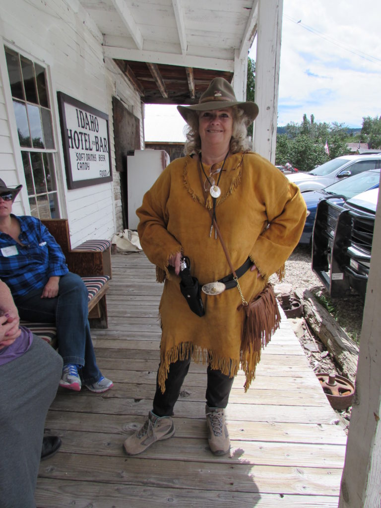 Kristin Holt | Historic Idaho Hotel in Silver City. Shirl Deems, Reader, dressed in real buckskin like a Mountain Man's lady. On the porch of the historic Idaho Hotel, Silver City, Idaho.