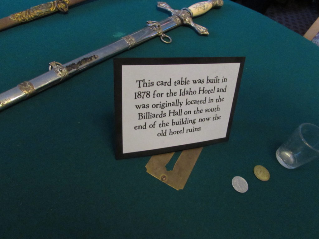 Kristin Holt | Historic Idaho Hotel in Silver City. Felt-topped card table (1878) original to the Billiards Hall (that section now in ruins) of the historic Idaho Hotel, Silver City, Idaho.