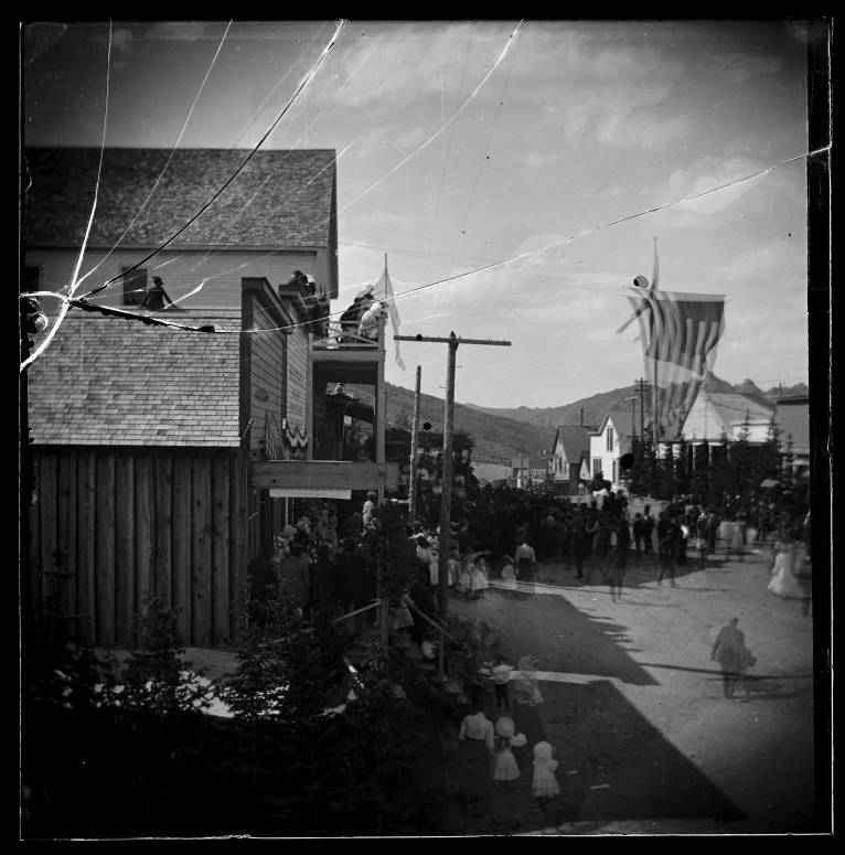 Kristin Holt | Historic Silver City, Idaho. Vintage image taken July 4, 1894: Silver City, looking north on the tree-lined Washington Street. Crowd is watching a drilling contest. Image courtesy of Idaho State Historical Society: P1960-139-5, Idaho State Archives.