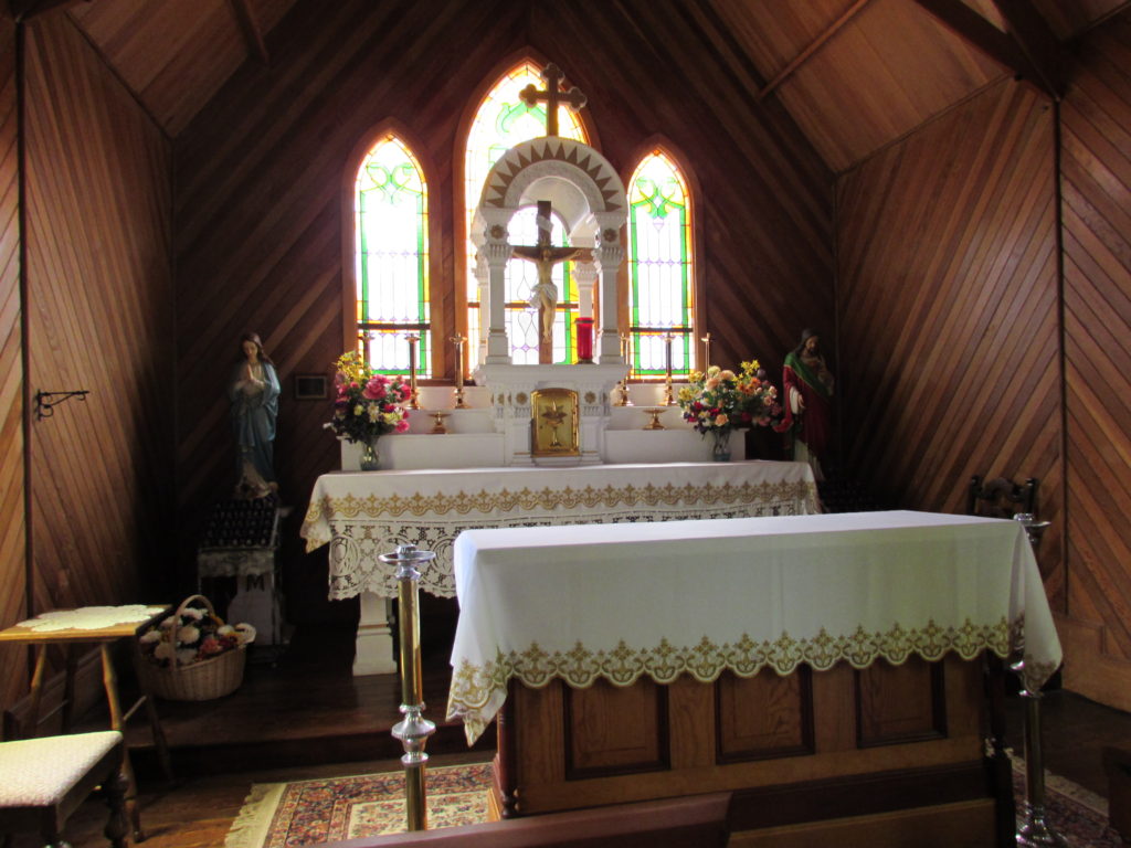 Kristin Holt | Silver City, Idaho's Historic Church 1898. Sanctuary, showing the historical (larger, in back) altar. Our Lady of Tears, historic Catholic Church in Silver City, Idaho.