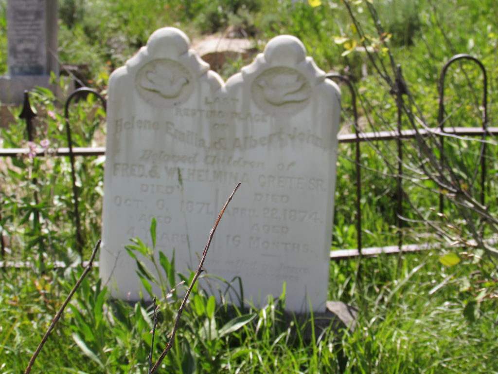 Kristin Holt | Silver City, Idaho's Ghost Town Cemetery. Last Resting Place of Helene Emillia & Albert John, Beloved Children of Fred & Wilhelmina Grete Sr. Died October 6, 1871, Aged 4 Years. Died April 22, 1874, aged 16 Months.
