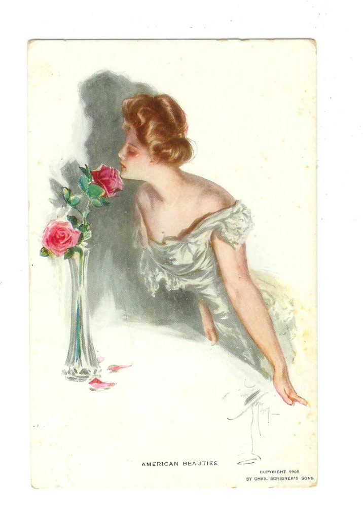 Kristin Holt | Vintage Postcard with artwork of turn-of-the-century woman in evening dress, inhaling the scen tof American Beauty Roses in a bud vase. Image courtesy of Jackie's Vintage Postcards.