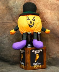 Kristin Holt | Victorian Americans Celebrate Oktoberfest. Photograph: Halloween decorations, including an orange pumpkin-like man with a tophat and purple boots.