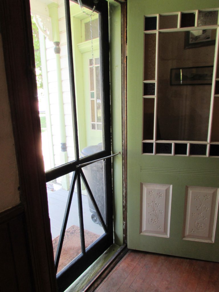 Kristin Holt | Screen Doors, a new invention!. Stricker Mansion's Screen Door. Stricker Ranch, Twin Falls County, Idaho. Photo taken by Kristin Holt.
