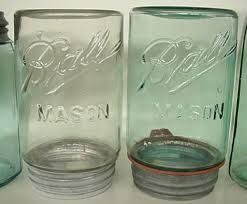 Kristin Holt | Old West Mason Jars. Photo of two Ball Masons, one clear and one blue. Ball Co. logo dates to 1900-1910. 