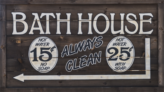 Kristin Holt | Old West Bath House. Vintage-like Bath House sign. Hot water 15 cents (no soap), or hot water 25 cents (with soap).