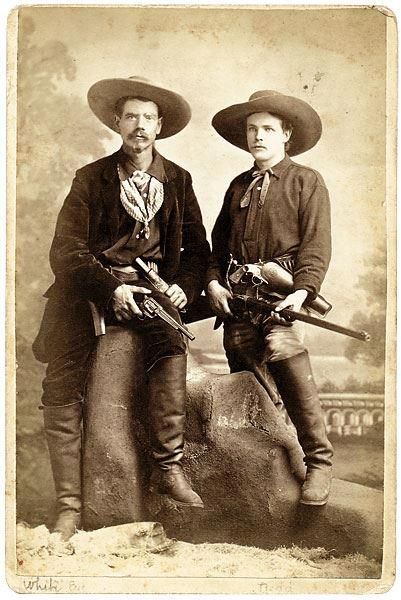 Kristin Holt | Armed Gunmen: Holsters, Braces, and Scabbards. This 1879 Leadville, Colorado, image shows two noted Westerners, (at left) Joseph â€œWhite Eyeâ€ Anderson, who accompanied Wild Bill Hickok to Deadwood in 1876, and his friend E. B. â€œYankeeâ€ Judd. Judd is packing a First Model Army Merwin Hulbert revolver in his holster and is holding what appears to be a Sharps Borchardt 1878 rifle. Image: Pinterest.