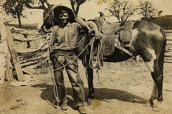 Kristin Holt | Armed Gunmen: Holsters, Braces, and Scabbards. Judging by the saddle style, this unidentified cowboy was working in the late 1870s or 1880s. In his holster, he carries a Colt model 1873 single action revolver with hard rubber grips, and he has looped his left arm around a Winchester model 1873 carbine in a saddle scabbard. On the back is the light pencil inscription â€œIndian fighter.â€ 