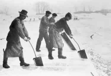 Kristin Holt | Nineteenth Century Ice Cutting, part 3. Vintage photograph of men cutting ice into blocks with metal saws (and a whole lot of elbow grease). Image: Canal Museum, United Kingdom.