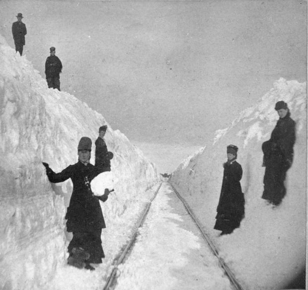 Kristin Holt | Victorian Blizzards, Nonstop in the 1880s. Vintage photograph: Crews clear snow along the Winona and St. Peter Railraod new Winona, Minnesota in 1881.