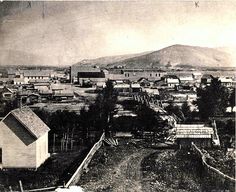 Kristin Holt | Old West Shootout--with a Rattlesnake. Vintage sepia-toned photograph of Salmon City, Idaho (1887). Courtesy: Pinterest.