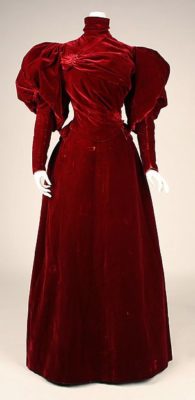 Kristin Holt | Ladies Fashions: Huge Sleeves of the 1890s. House of Worth Designer Charles Frederick Worth, 1893-1895. Photograph of red velvet gown with enormous puffy sleeves. Courtesy of The Met, via Pinterest.