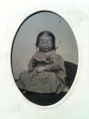 Kristin Holt | Victorian-American Headaches: Part 3. Vintage photograph (19th century) of a small child, crying.